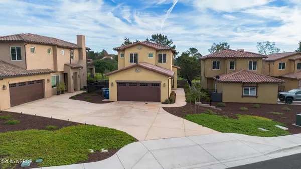 a view of house with yard and entertaining space
