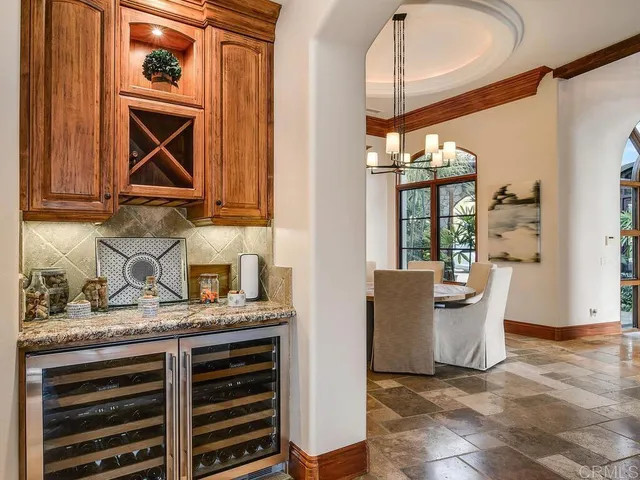 a bedroom with a bed a fireplace and a large window