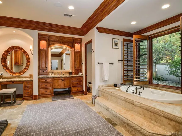 a living room with furniture a rug and a large window