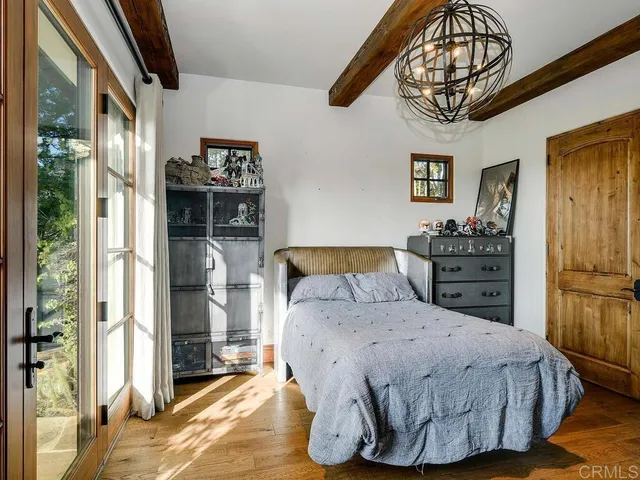a view of an outdoor sitting area with furniture and umbrella