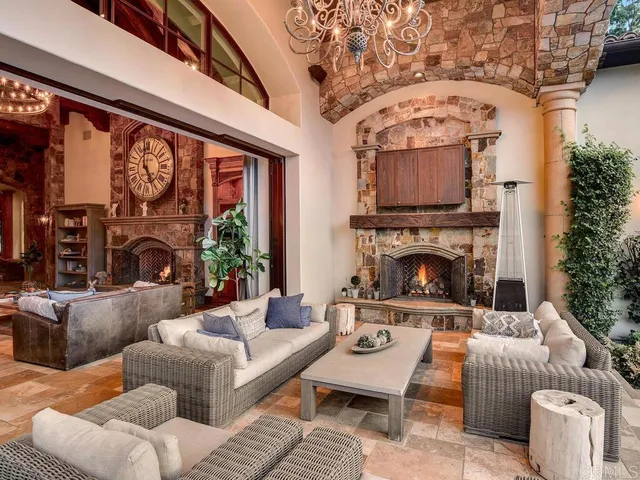 a dining table with wooden floor and kitchen view