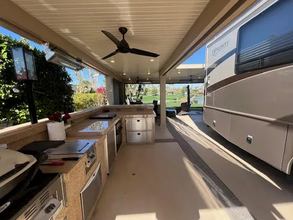 a kitchen with stainless steel appliances granite countertop a sink and a stove