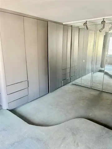 a bathroom with a sink and mirror