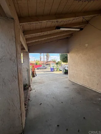 a view of a porch with seating space