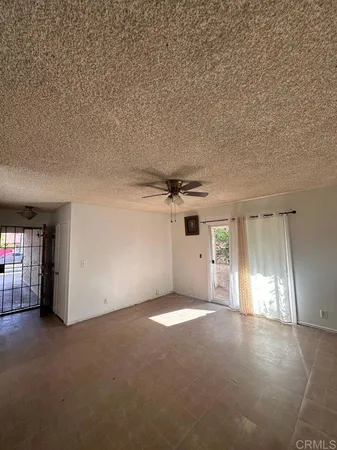 an empty room with a empty space and windows