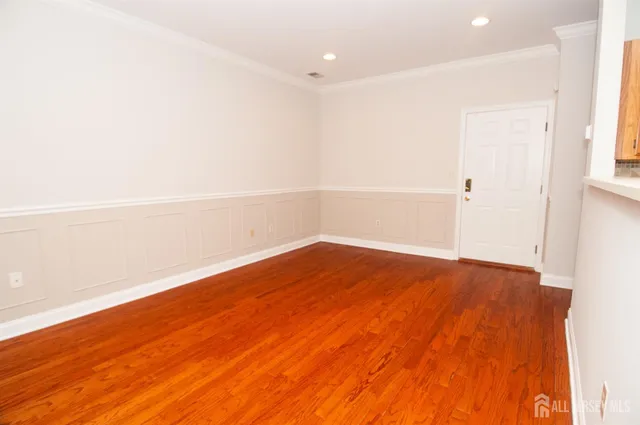 a kitchen with granite countertop a refrigerator and a stove top oven