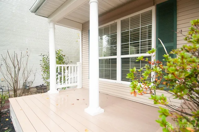 a view of a house with brick walls and potted plants