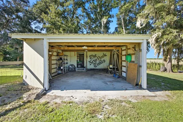 a spacious bedroom with a bed and a potted plant