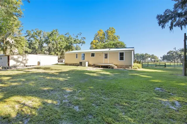an empty room with a ceiling fan and painted walls
