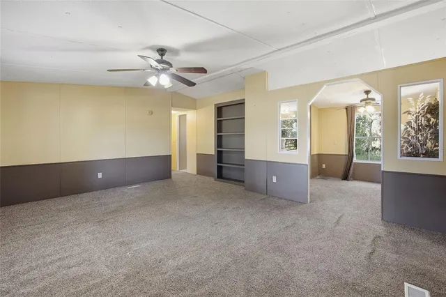 an empty room with a empty space and a window