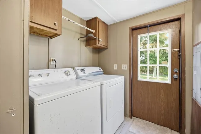 an aerial view of a houses with swimming pool