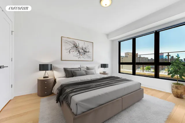 a bedroom with a large bed and a large window