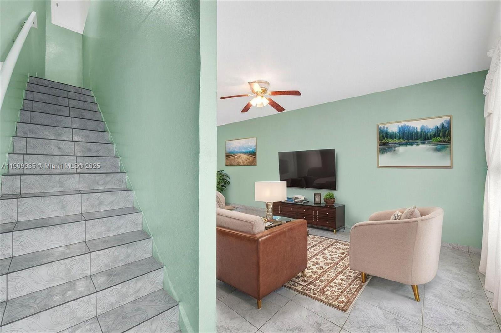 427 Northwest 84th Terrace, Unit 427 Miami, FL 33150 - Photo 11 of 40 a living room with furniture and a flat screen tv