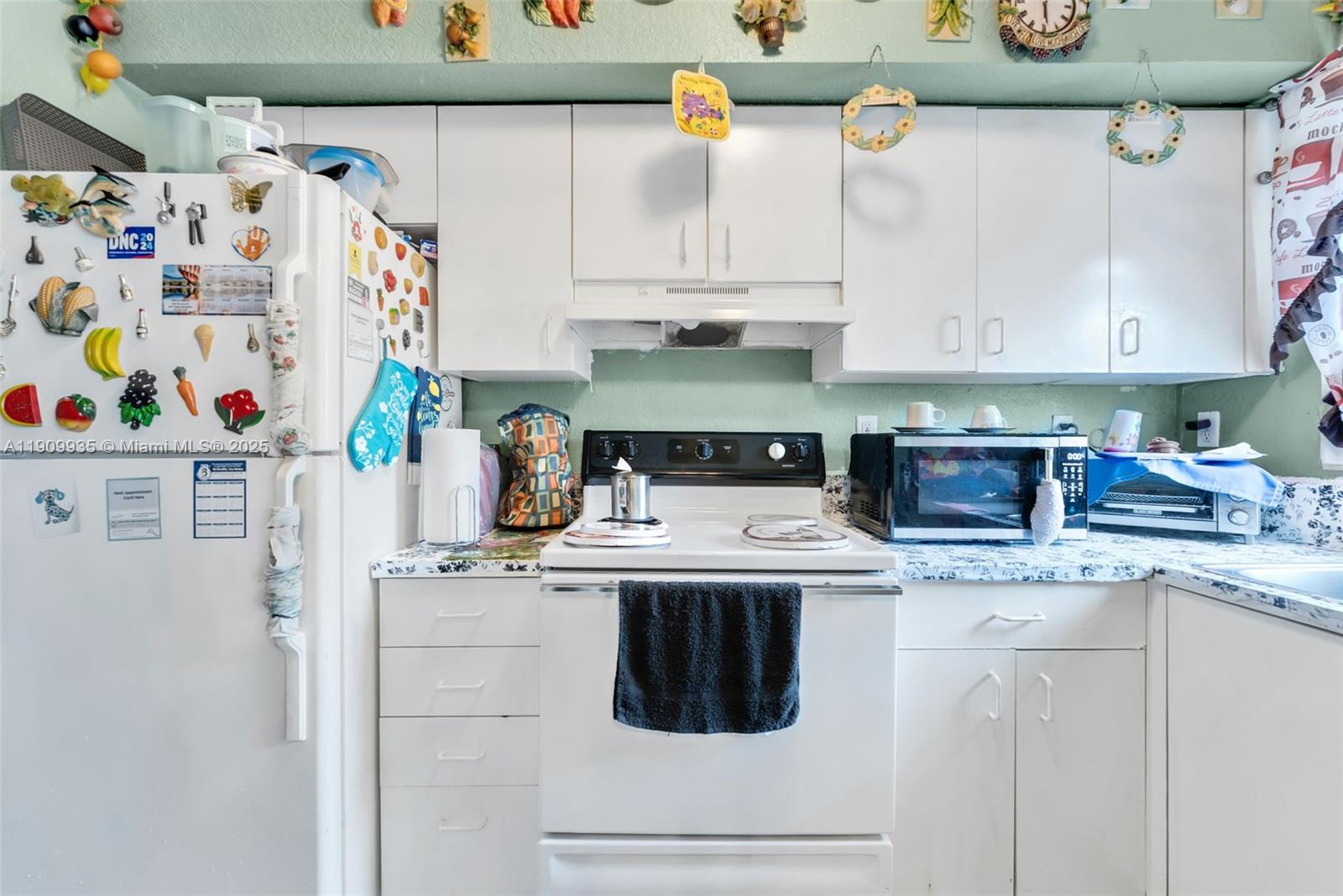 427 Northwest 84th Terrace, Unit 427 Miami, FL 33150 - Photo 24 of 40 a utility room with stainless steel appliances and cabinets