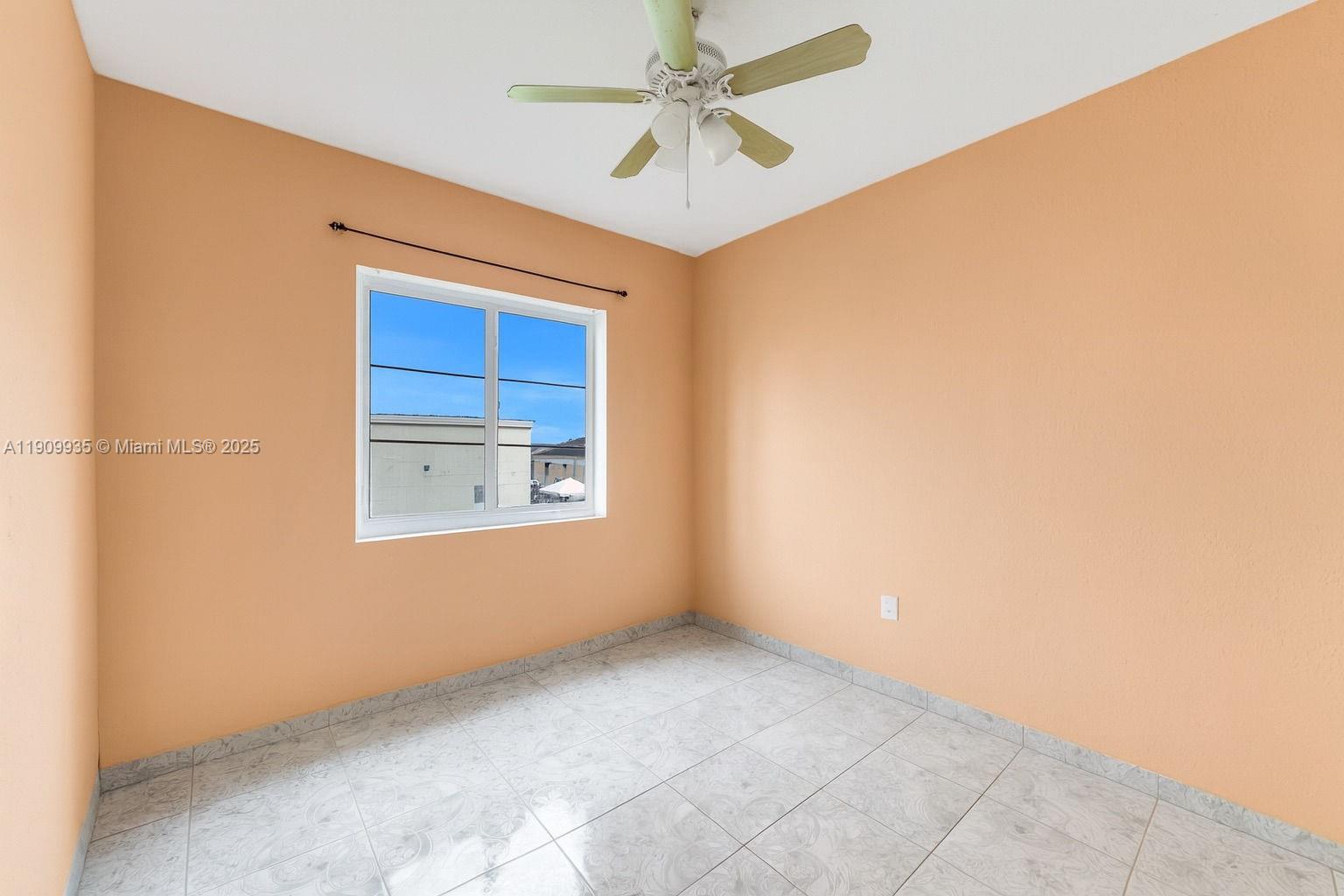 427 Northwest 84th Terrace, Unit 427 Miami, FL 33150 - Photo 26 of 40 a view of an empty room with a window