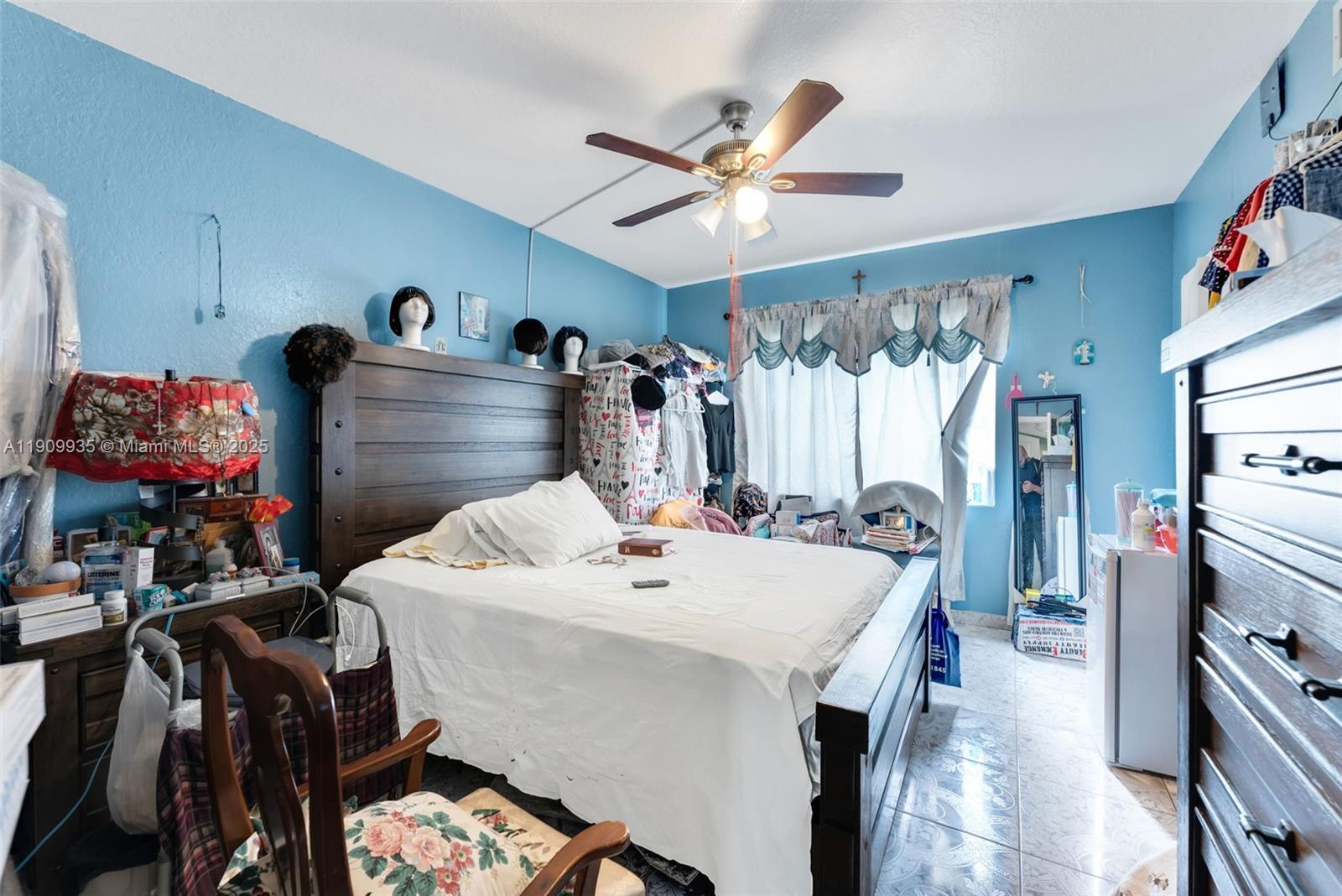 427 Northwest 84th Terrace, Unit 427 Miami, FL 33150 - Photo 32 of 40 a room with a bed and a chandelier