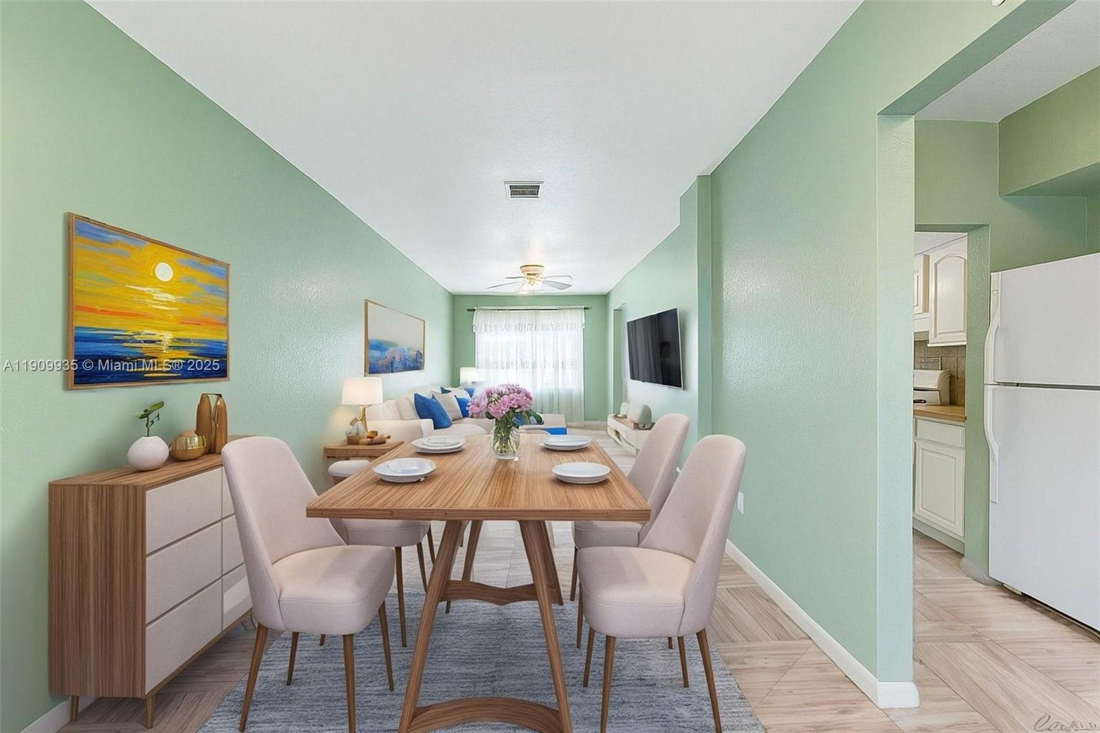 427 Northwest 84th Terrace, Unit 427 Miami, FL 33150 - Photo 5 of 40 a view of a dining room with furniture and wooden floor