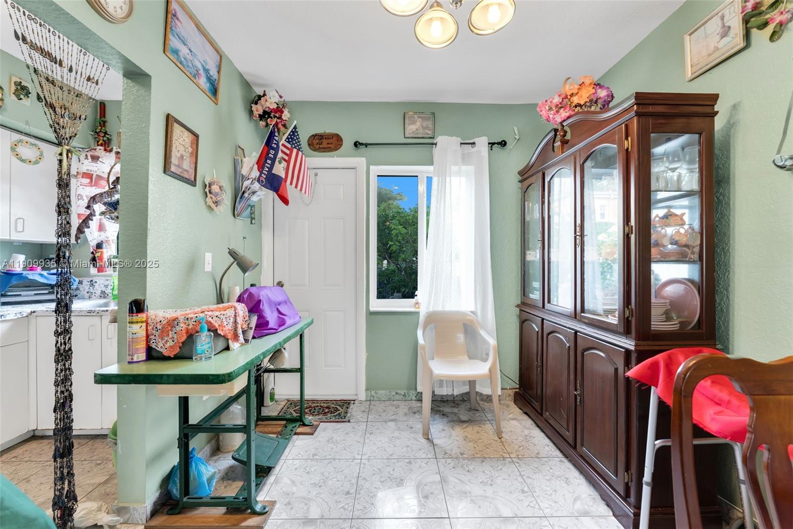 427 Northwest 84th Terrace, Unit 427 Miami, FL 33150 - Photo 6 of 40 a living room with furniture and a potted plant
