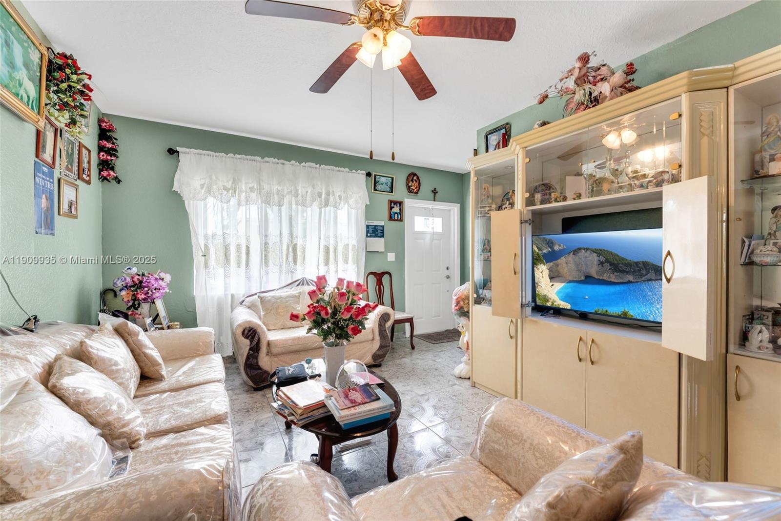 427 Northwest 84th Terrace, Unit 427 Miami, FL 33150 - Photo 9 of 40 a living room with furniture and a large window