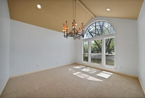 a view of a livingroom with a kitchen