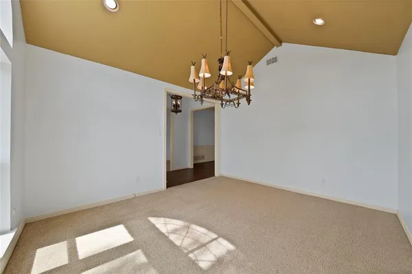 a view of a chandelier in big room
