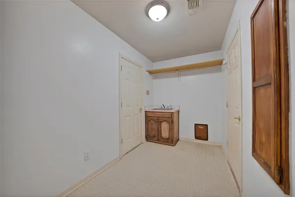 a view of empty room with windows