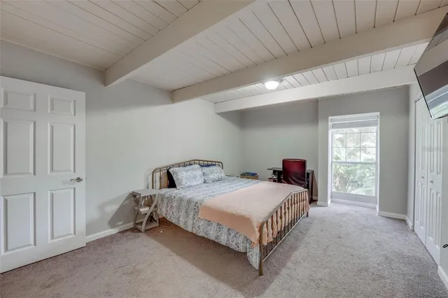 a bedroom with a bed and a cabinets
