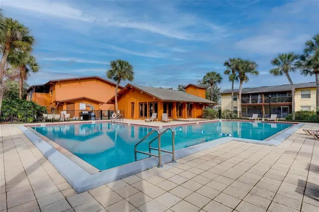a view of swimming pool with a patio