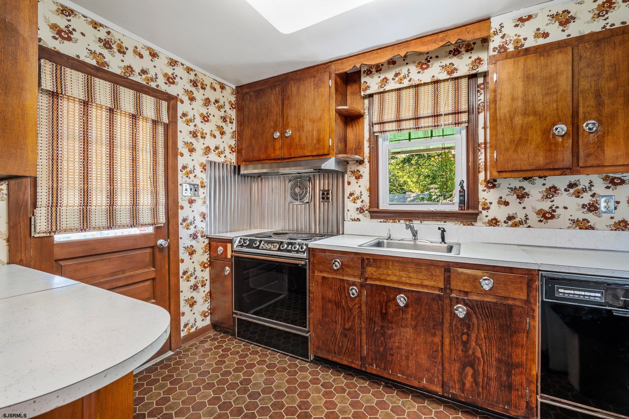 161 Coolidge Avenue Absecon, NJ 08201 - Photo 11 of 26 a kitchen with stainless steel appliances granite countertop a stove a sink and a microwave