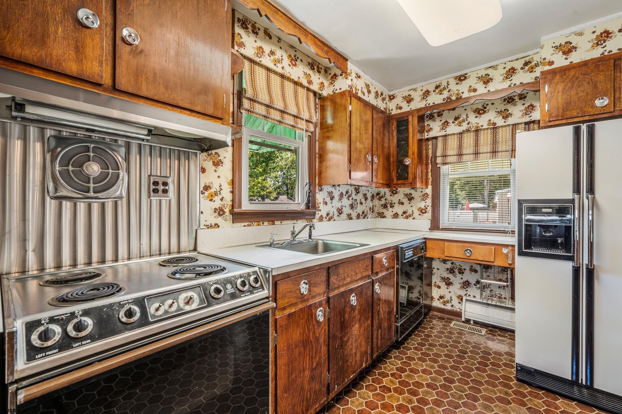 161 Coolidge Avenue Absecon, NJ 08201 - Photo 12 of 26 a kitchen with stainless steel appliances granite countertop a stove and a sink
