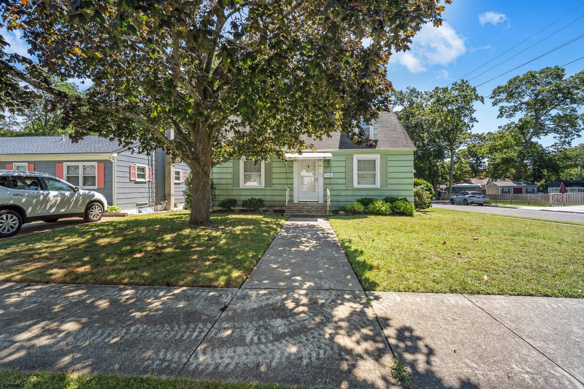 161 Coolidge Avenue Absecon, NJ 08201 - Photo 2 of 26 a front view of a house with garden
