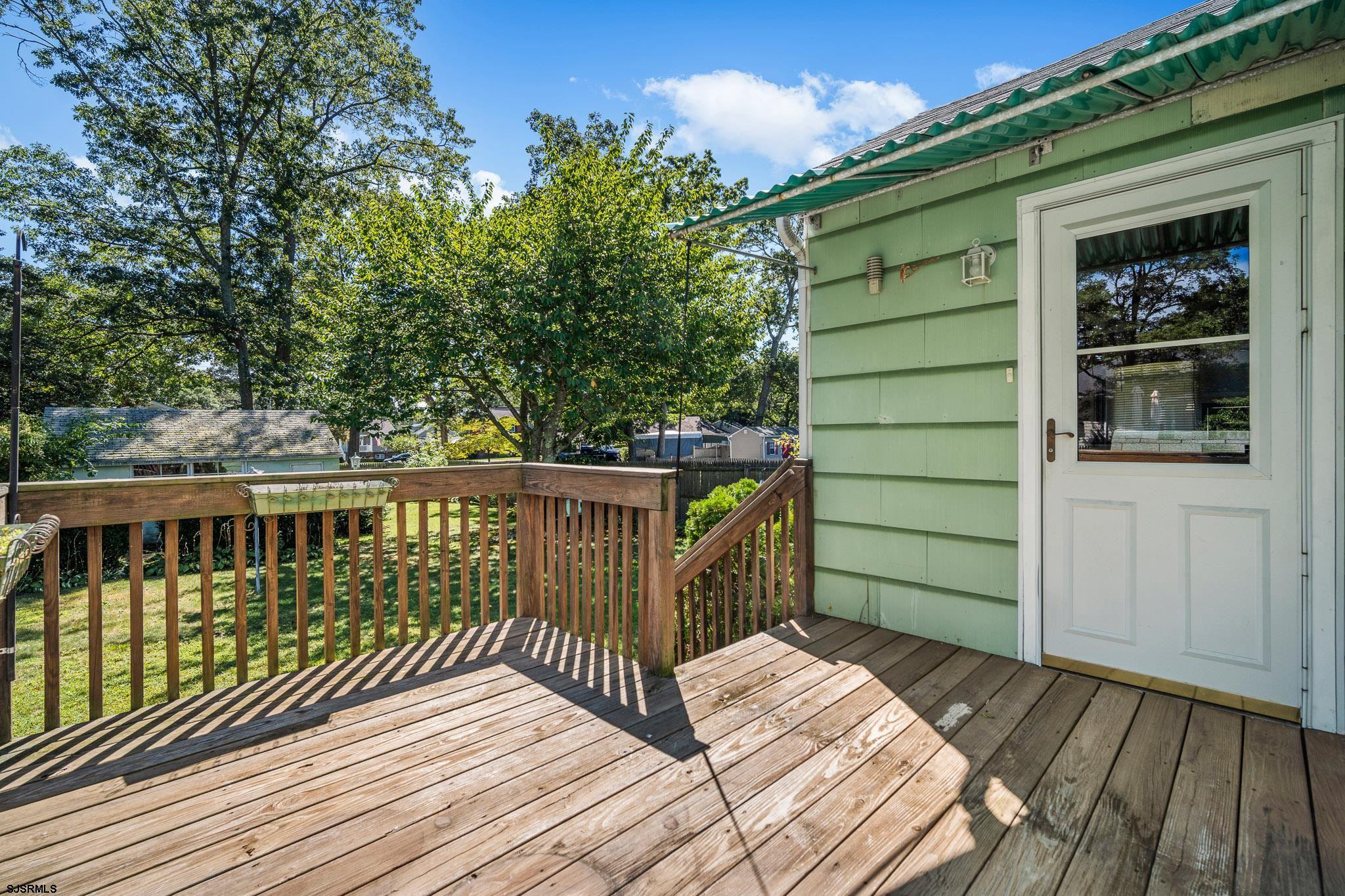161 Coolidge Avenue Absecon, NJ 08201 - Photo 22 of 26 a view of balcony with wooden floor and fence