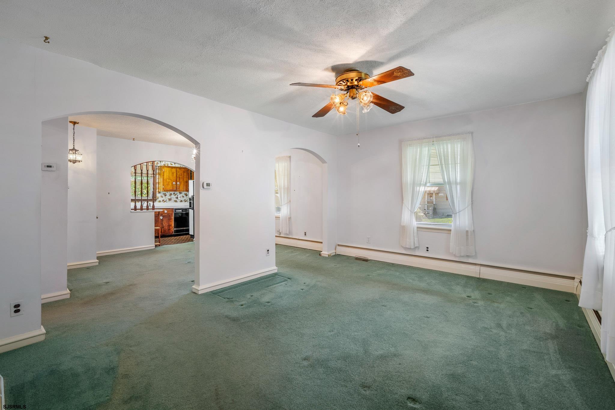 161 Coolidge Avenue Absecon, NJ 08201 - Photo 4 of 26 an empty room with windows and cabinet