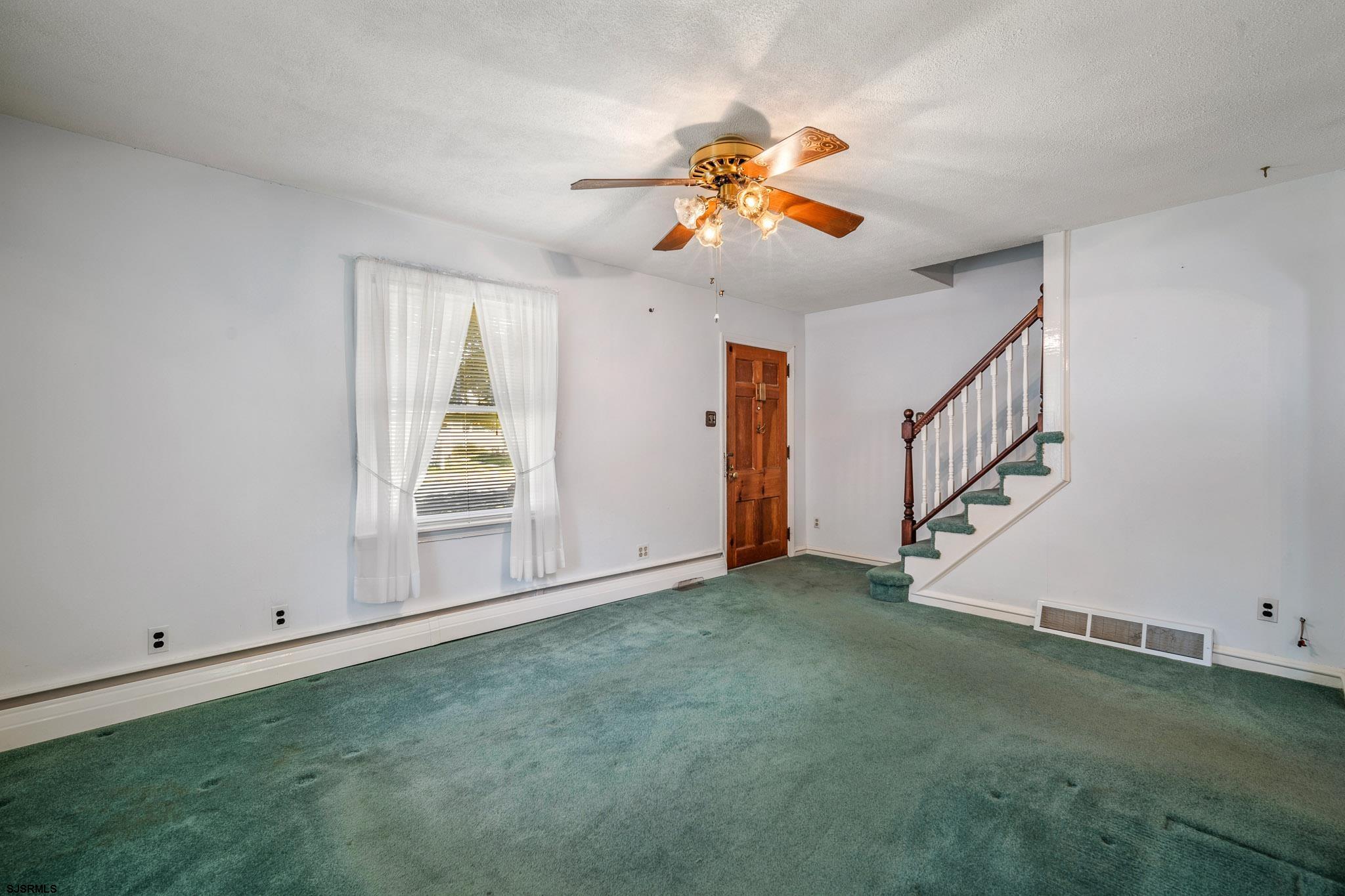 161 Coolidge Avenue Absecon, NJ 08201 - Photo 6 of 26 wooden floor in an empty room with a window