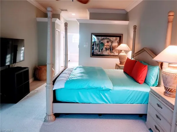 a bedroom with bed and a couch