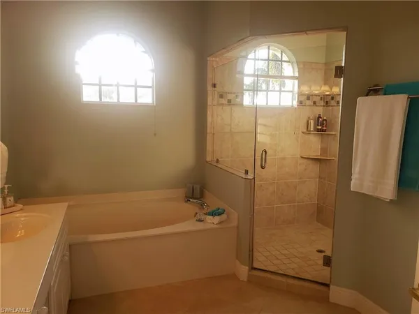 a bathroom with a bathtub and a shower