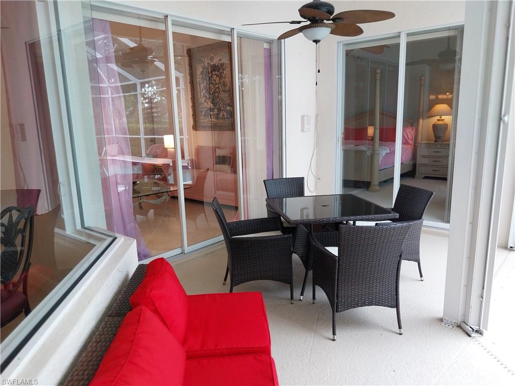 8906 Lely Island Circle Naples, FL 34113 - Photo 24 of 36 a living room with furniture