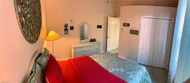 a view of walk in closet with rug and wall