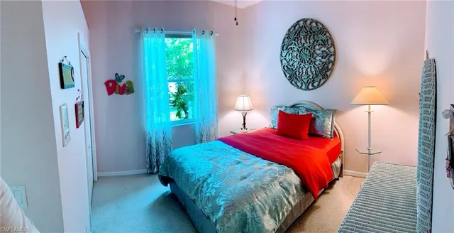 a bedroom with bed and a window