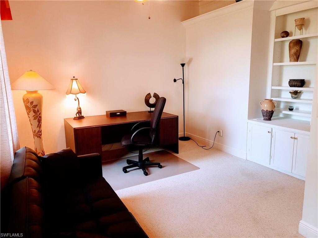 8906 Lely Island Circle Naples, FL 34113 - Photo 35 of 36 a view of a workspace with furniture