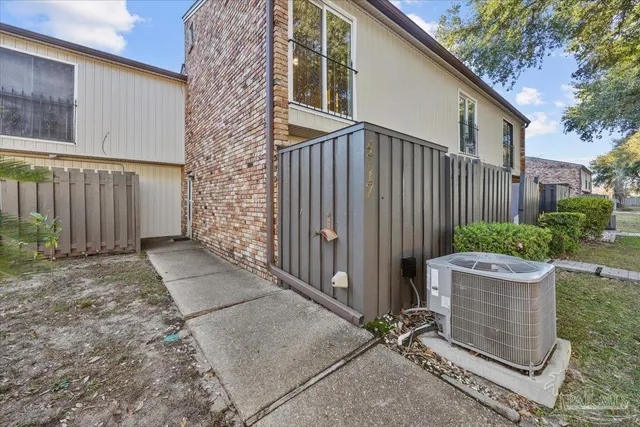 an aerial view of a house with a yard and lake view