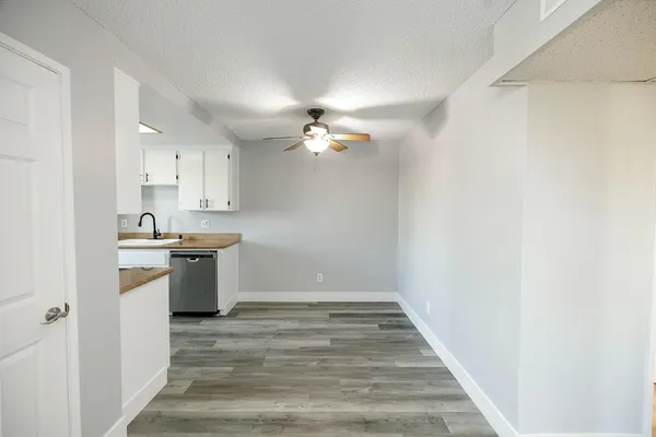 a view of a kitchen with a sink cabinets and a window