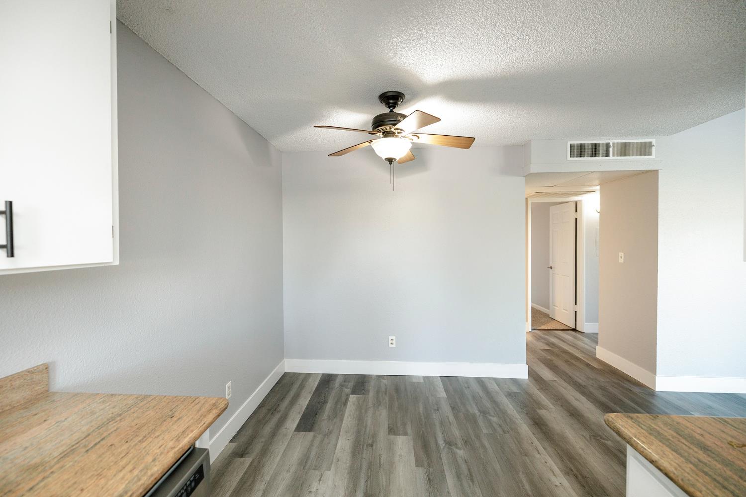 1313 Floyd Avenue, Unit 122 Modesto, CA 95355 - Photo 15 of 35 wooden floor in an empty room with a window