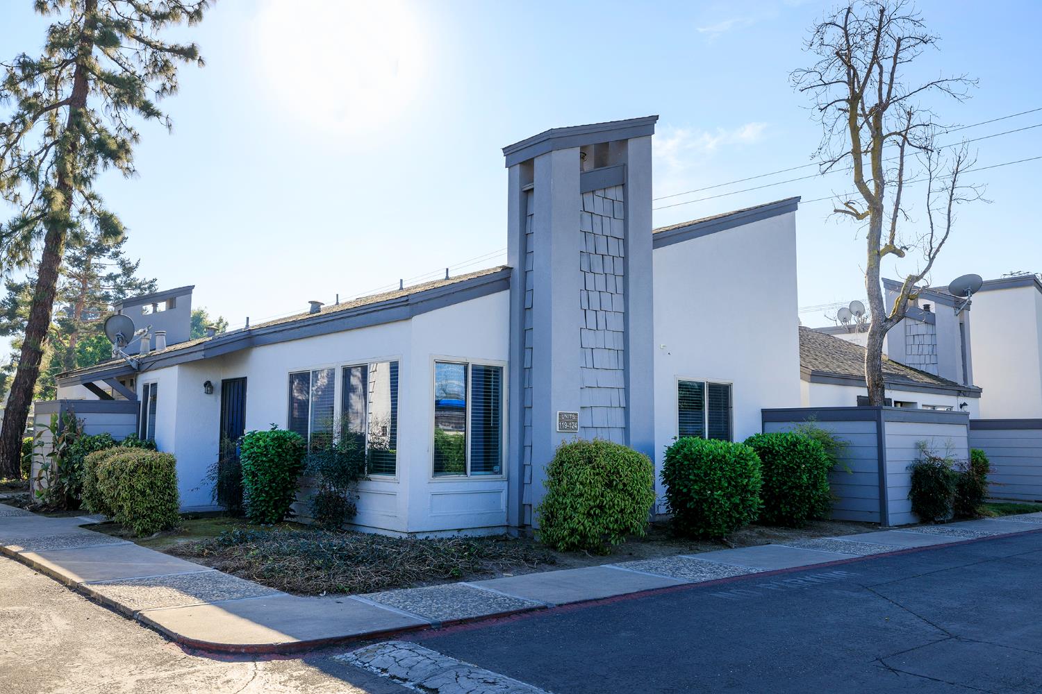 1313 Floyd Avenue, Unit 122 Modesto, CA 95355 - Photo 2 of 35 a front view of a house with garden