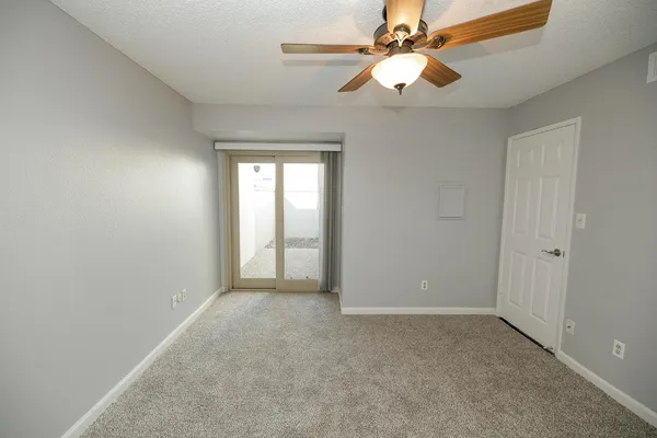 a view of an empty room with a window