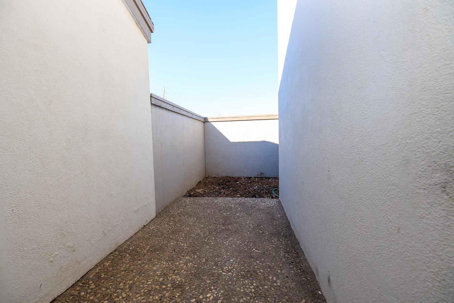 1313 Floyd Avenue, Unit 122 Modesto, CA 95355 - Photo 24 of 35 a view of a hallway with wooden floor