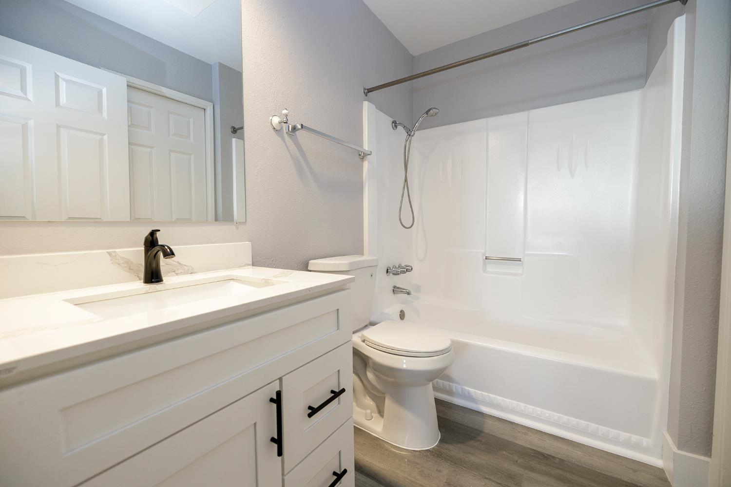 1313 Floyd Avenue, Unit 122 Modesto, CA 95355 - Photo 27 of 35 a bathroom with a sink toilet a shower and bathtub