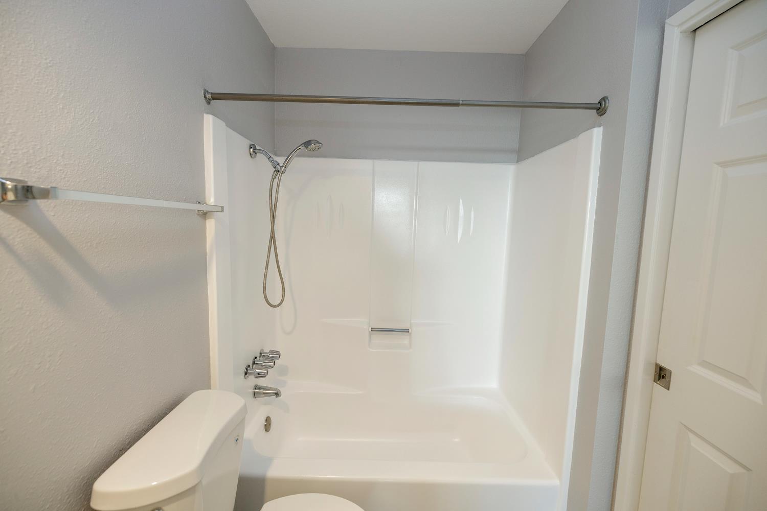 1313 Floyd Avenue, Unit 122 Modesto, CA 95355 - Photo 28 of 35 a bathroom with a shower and a toilet