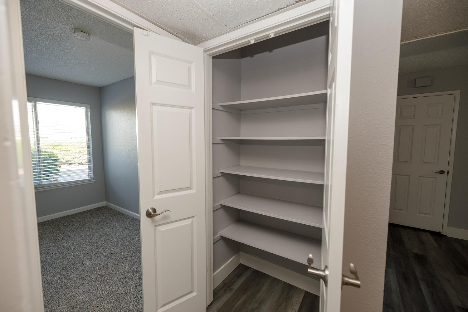 1313 Floyd Avenue, Unit 122 Modesto, CA 95355 - Photo 29 of 35 a view of walk in closet with empty racks