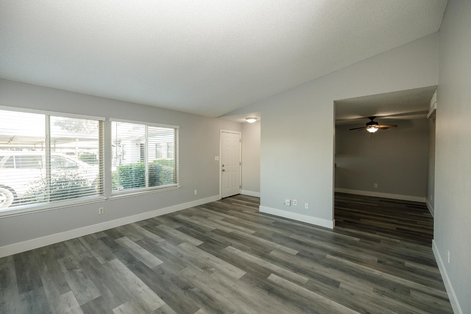 1313 Floyd Avenue, Unit 122 Modesto, CA 95355 - Photo 9 of 35 wooden floor in an empty room with a window